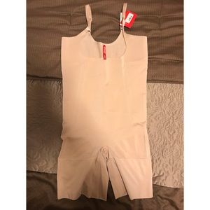 Spanx open bust mid thigh bodysuit.